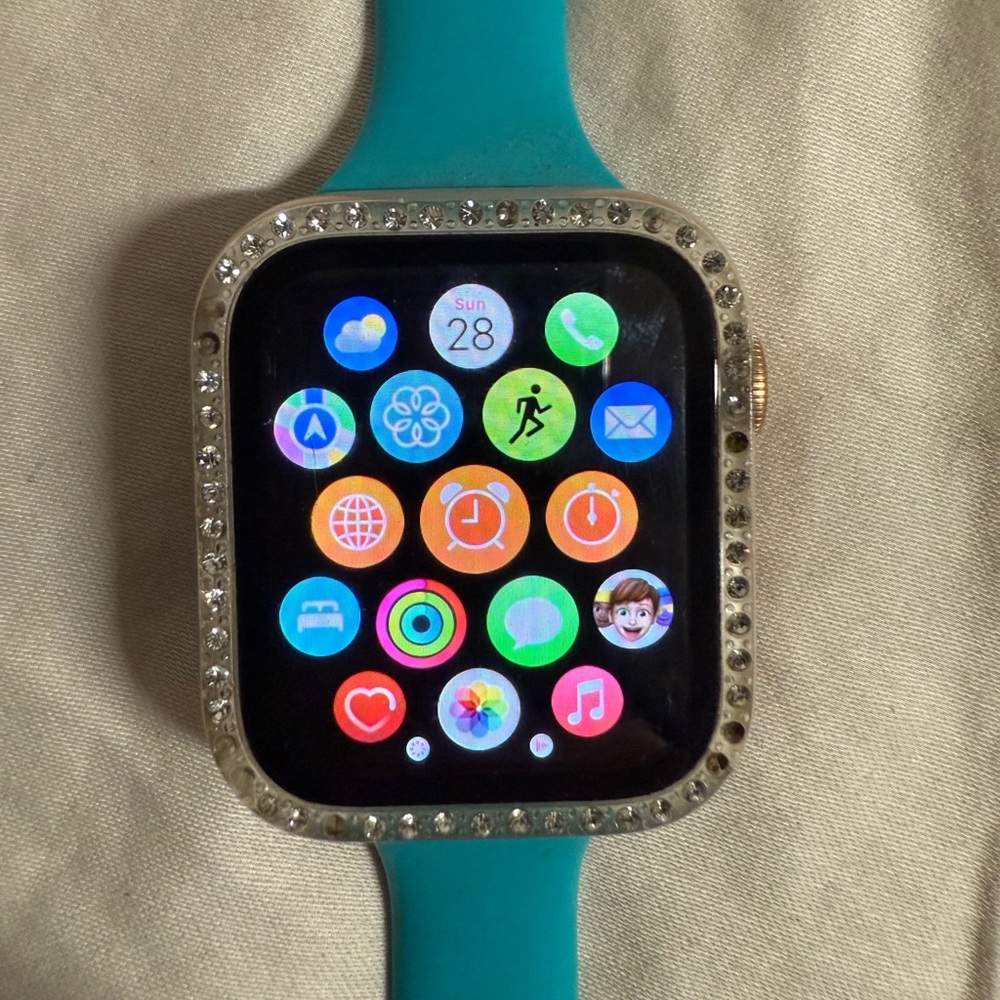Apple Smartwatch with Teal Band and Silver Bezel